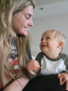 Lennox and his mother Kelsy look at each other with big smiles.